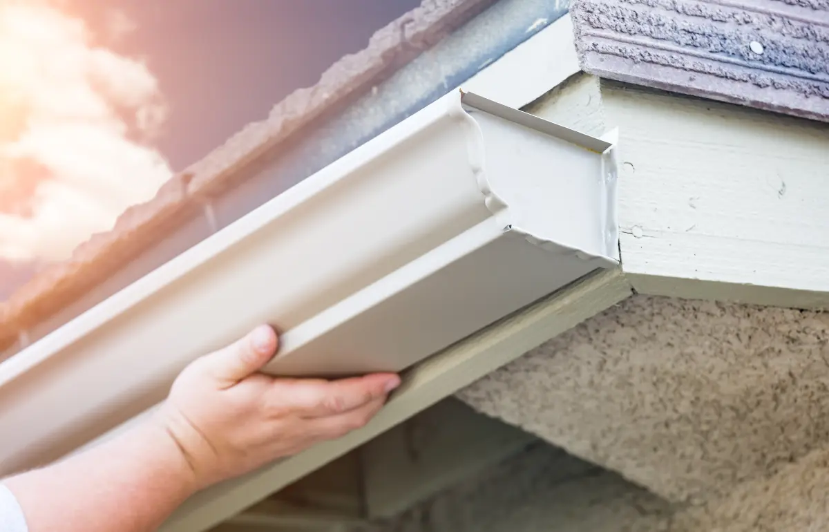 Rain gutter along the roofline of a home